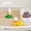 A set of Miffy and friends cute magnets featuring a rabbit character on a green background, displayed on stacked boxes.
