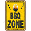 A vintage yellow tin sign with black text reading BBQ ZONE, featuring crossed utensils and a flame icon.