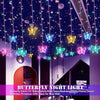 A display of colorful LED butterfly night lights hanging from the ceiling in a room setting.