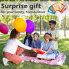 A family of five is posing for a surprise gift photo, surrounded by colorful magnetic photo frames.