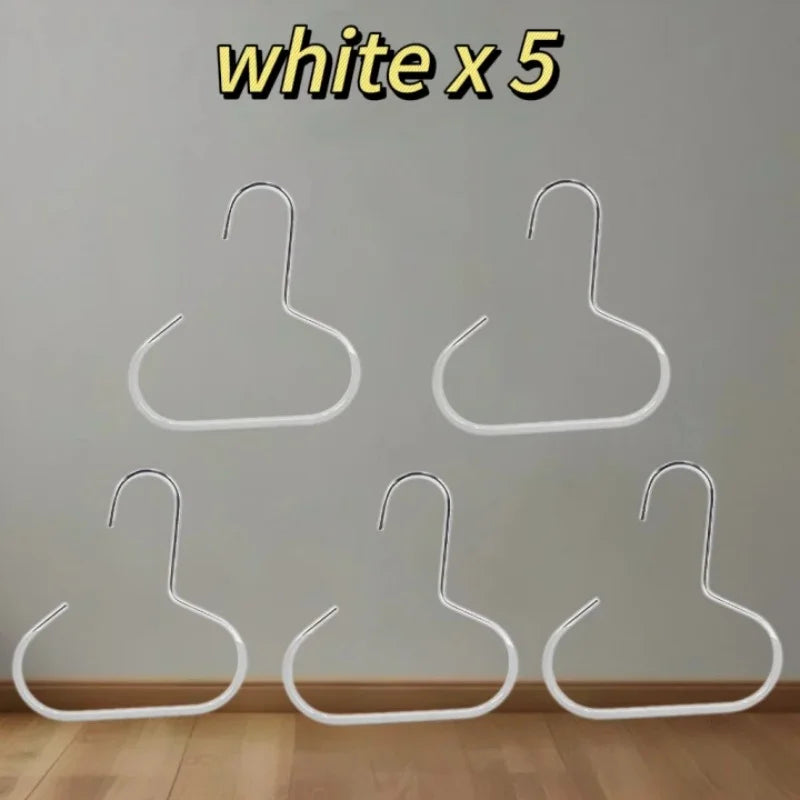 Five white hat organizer racks hanging against a light gray wall.