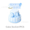 A white cake decorated with light blue icing and a blue bow, featuring fondant letters spelling BABY BOY.