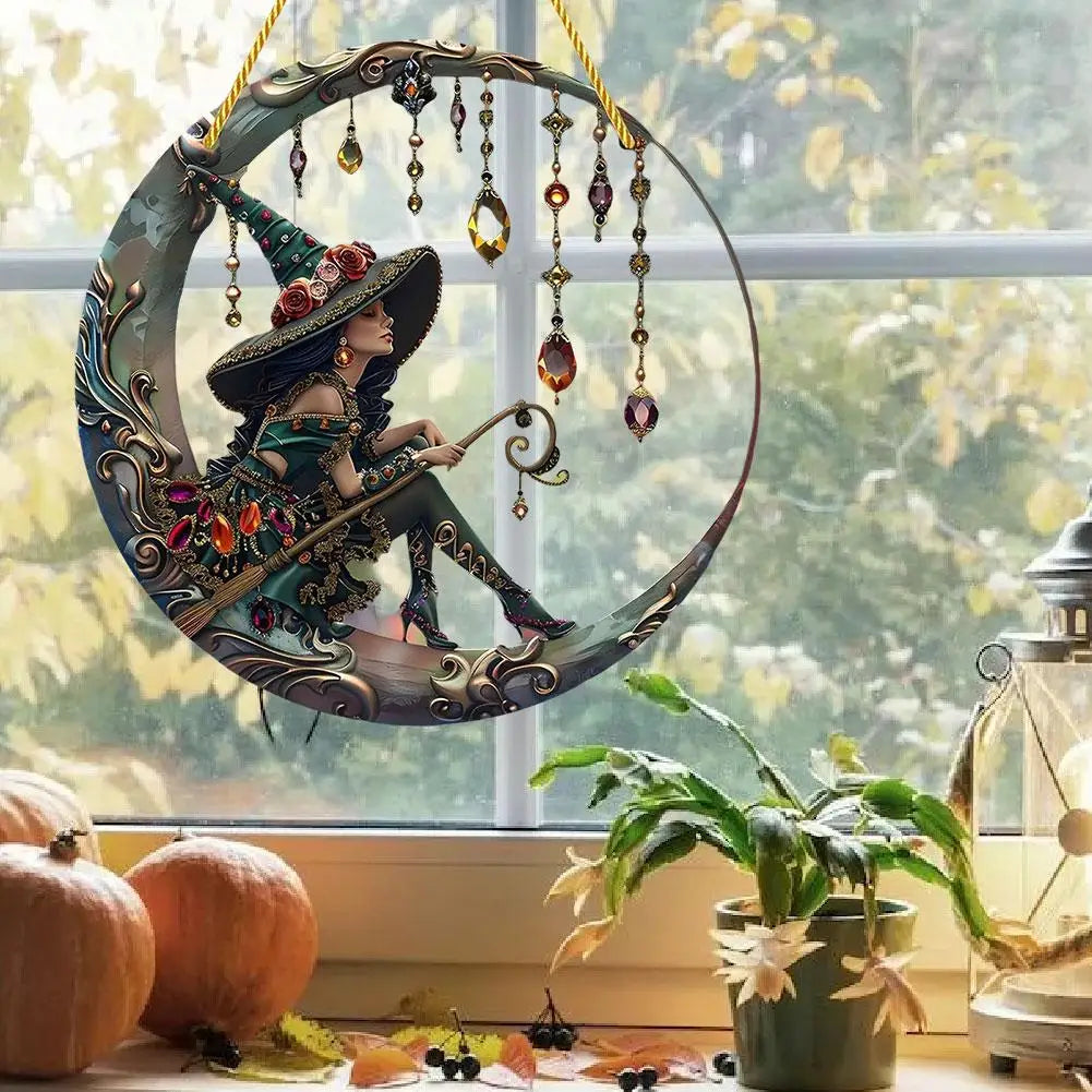 A witch figure with a pointed hat is suspended in a circular stained glass window decoration.