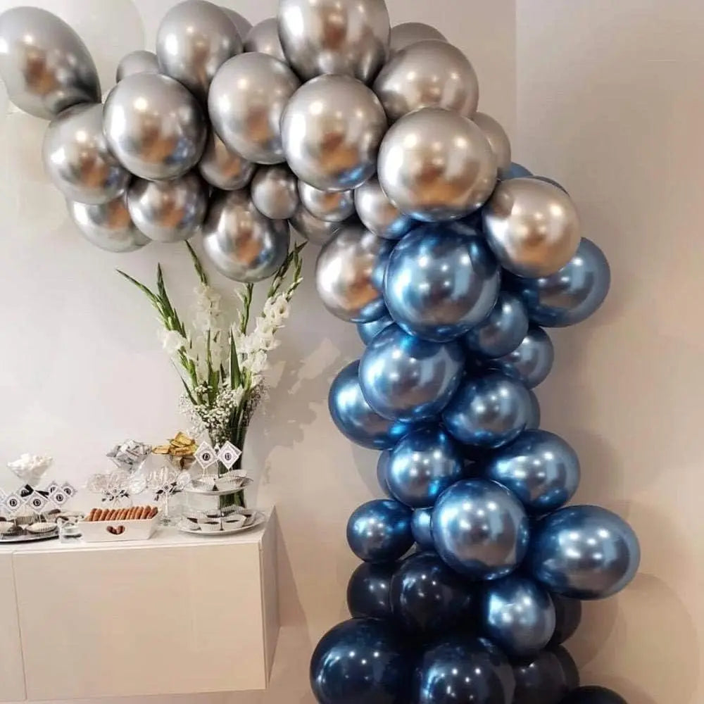 A vertical arrangement of chrome metallic latex balloons in silver and blue shades for party decor.
