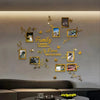 A wall decorated with gold foliage and various photo frames featuring family and love themes.