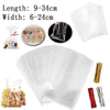 Clear cellophane treat bags with wire ties and various sized clear plastic bags shown in a collection