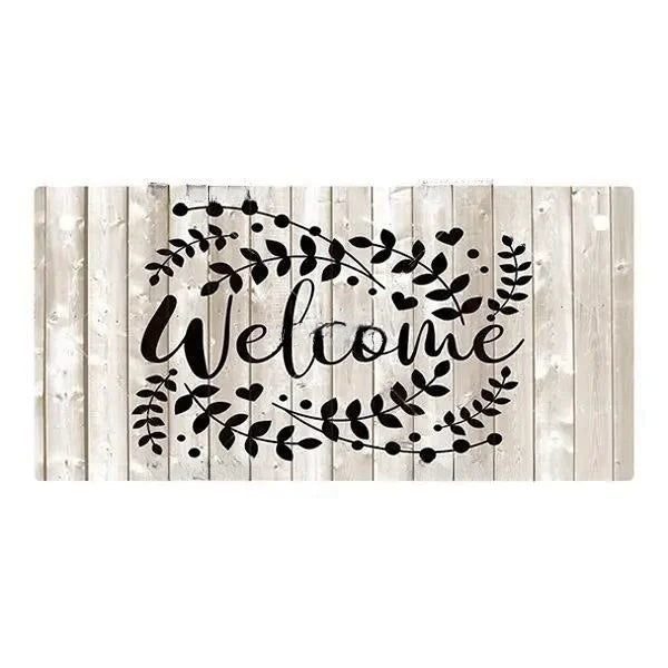 Rustic wooden hanging sign with the word Welcome written in black script surrounded by leafy vines.
