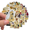 A hand holds a collection of funny cartoon dog meme decals featuring various dog breeds and expressions.