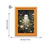 A framed picture featuring a white ghost surrounded by flowers in an ornate gold frame.