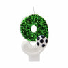 A number zero candle decorated with green glitter and a soccer ball shape.