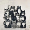 Black silhouette cat wall art featuring various feline faces in a row