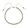 Handmade boho glass bead bracelet with adjustable cord featuring dark brown and gold beads.