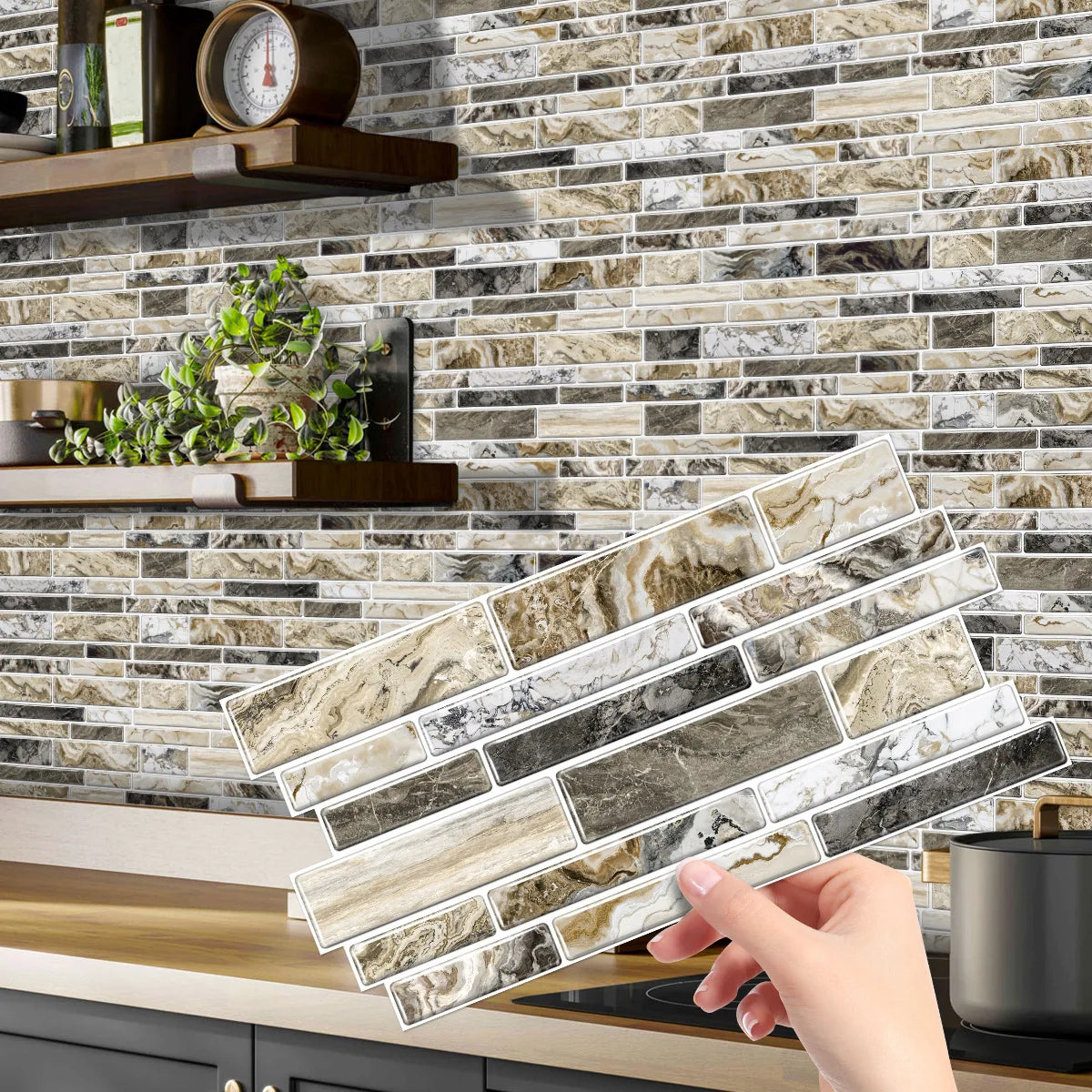 A hand holds a rectangular panel of crystal film marble wall decal against a textured stone tile background.