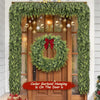 Artificial cedar garland hanging on a wooden door for holiday decoration