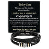 A black braided leather cuff bracelet with engraved text on a dark card.