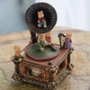 A vintage carousel music box decoration featuring a small rabbit figurine on top.