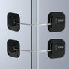 Two black stainless steel combination refrigerator locks mounted on a glass surface.
