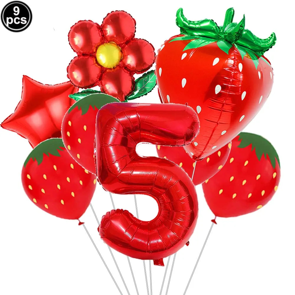 A pack of red strawberry shaped balloons and a large red number five balloon for a party kit