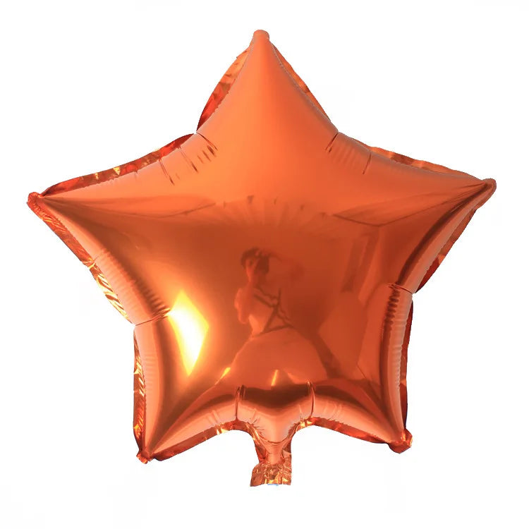 An orange foil star and heart balloon assortment.