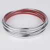 Silver and pink self-adhesive PVC wall trim tape rolled into a circular shape