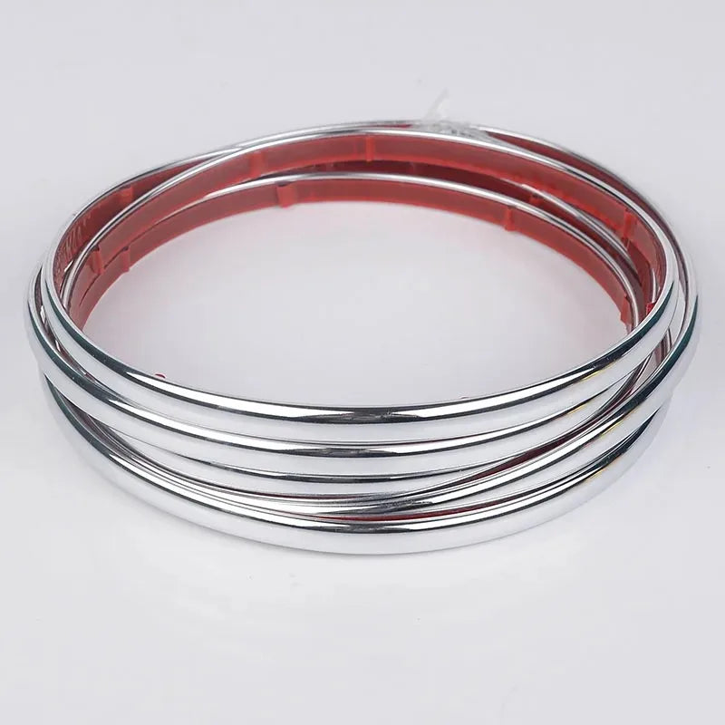 Silver and pink self-adhesive PVC wall trim tape rolled into a circular shape