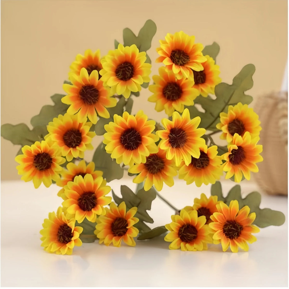 A bouquet of three lifelike silk gerbera daisy artificial flowers in vibrant yellow and orange tones.