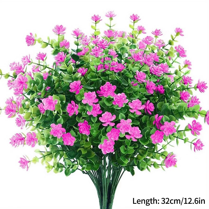 Un bouquet de fleurs artificielles roses et vertes pour décoration d'automne ou d'Halloween.