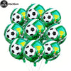 A pack of ten green and white soccer ball balloons with gold trophies, used for party decorations.