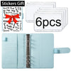 A set of six clear stickers with a red bow on a light blue leather planner binder.