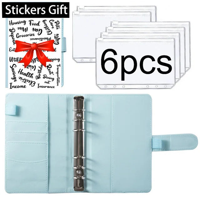 A set of six clear stickers with a red bow on a light blue leather planner binder.