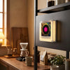 A retro NFC music box night light with a rotating disc is displayed on a dark shelf in a modern interior.