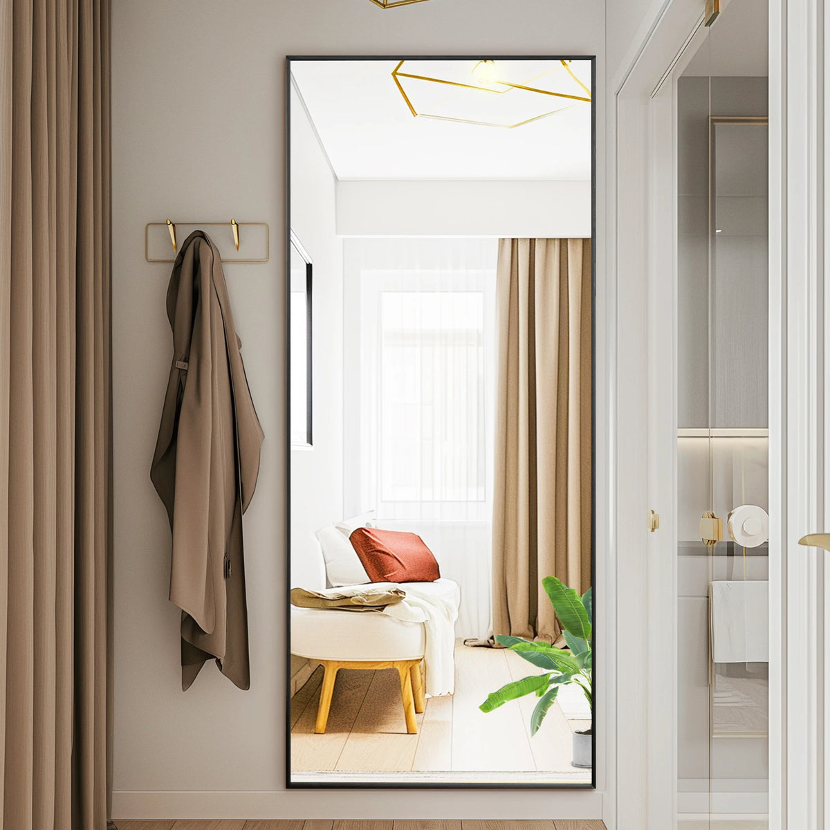 A modern arched full-length mirror with a gold frame is shown in a bright bathroom setting.