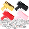 Three colorful toy guns, red, yellow, and pink, are scattered on a surface of fake money.