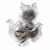 A clear capsule shaped like a cat with whiskers and fur, used as a keepsake magnet.