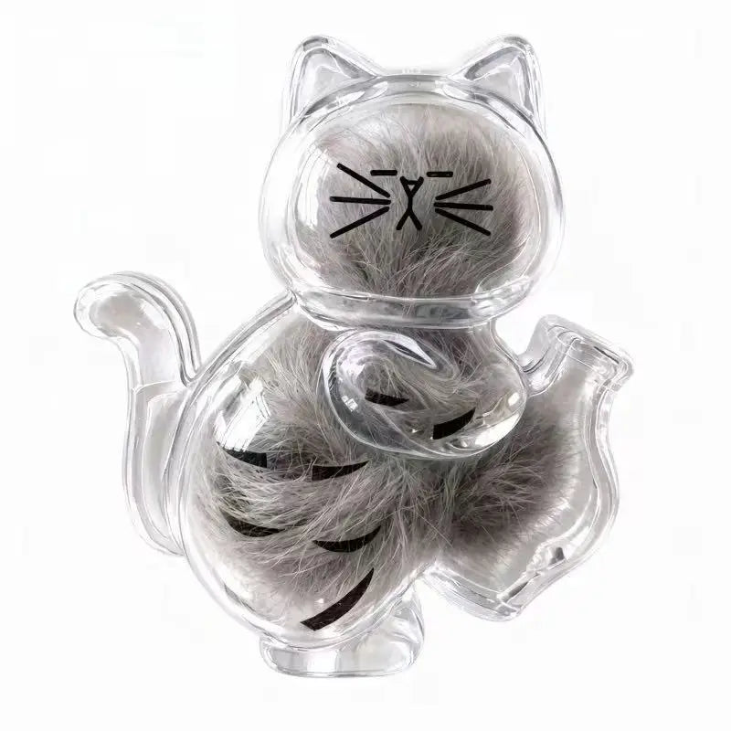 A clear capsule shaped like a cat with whiskers and fur, used as a keepsake magnet.