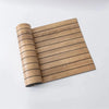 A roll of 3D wood grain self-adhesive wallpaper showing horizontal wood lines.
