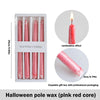 Set of four pink red pole wax taper candles with a dripping blood effect in an elegant gift box.