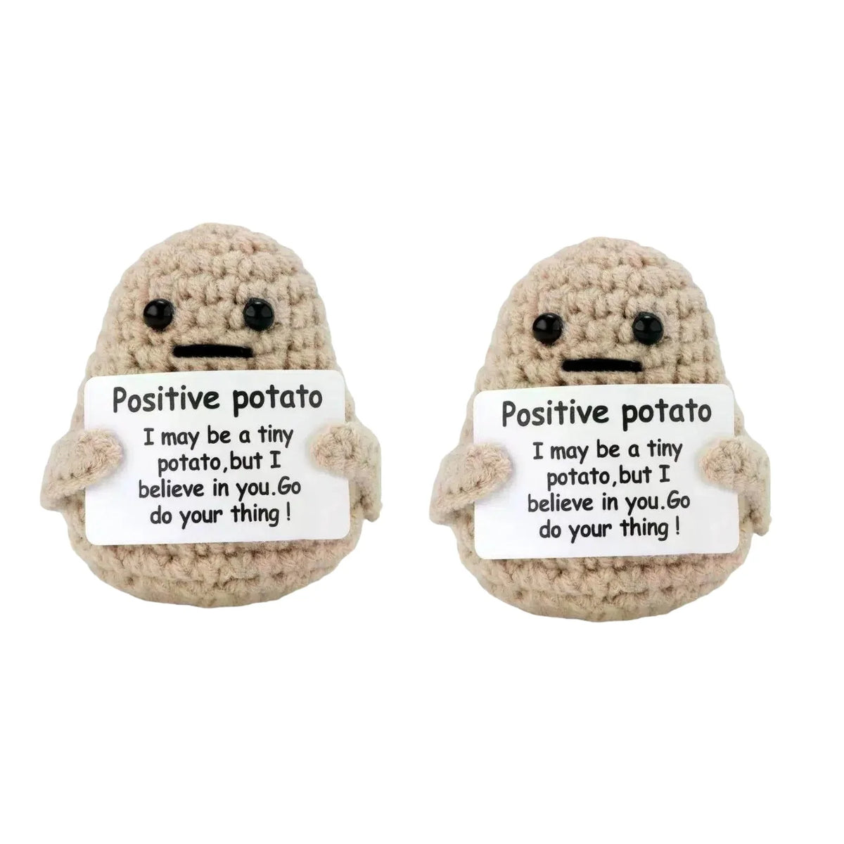 Two handmade knitted plush potato dolls with signs encouraging self-belief
