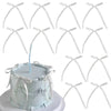 A white cake decorated with light blue frosting and silver ribbon bow toppers.