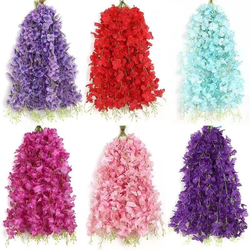 A collection of artificial wisteria hanging flower garlands in various shades of purple, pink, and blue.