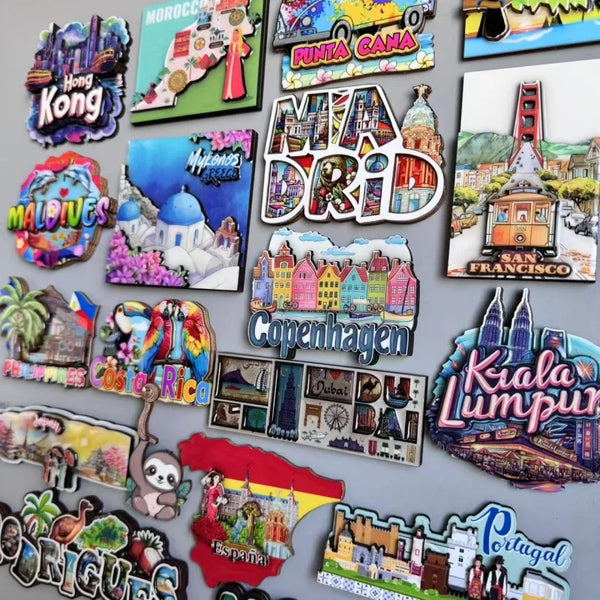 A collection of wooden fridge magnets featuring various destinations like Hong Kong, Maldives, Copenhagen, and Portugal.