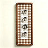 A wooden photo strip frame with a brown and tan checkered pattern displaying five portrait photos of a couple.