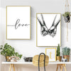 Minimalist couple line art canvas print featuring two hands joined on a white background.
