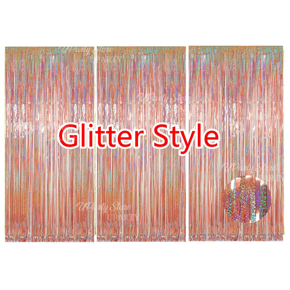 A set of three metallic fringe curtains with glittery strands used as a party backdrop decor.