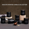 A collection of black scented candles in jars, including Caramel Coffee, Lemon Eucalyptus, and Sage & Citrus.