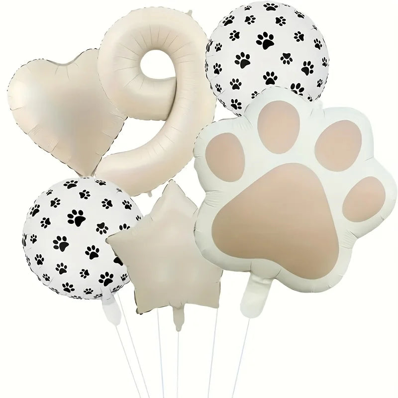 A set of six white foil balloons shaped like paw prints and a number, suitable for a party.