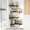 A set of black corner-mounted wood floating shelves used for kitchen organizing.