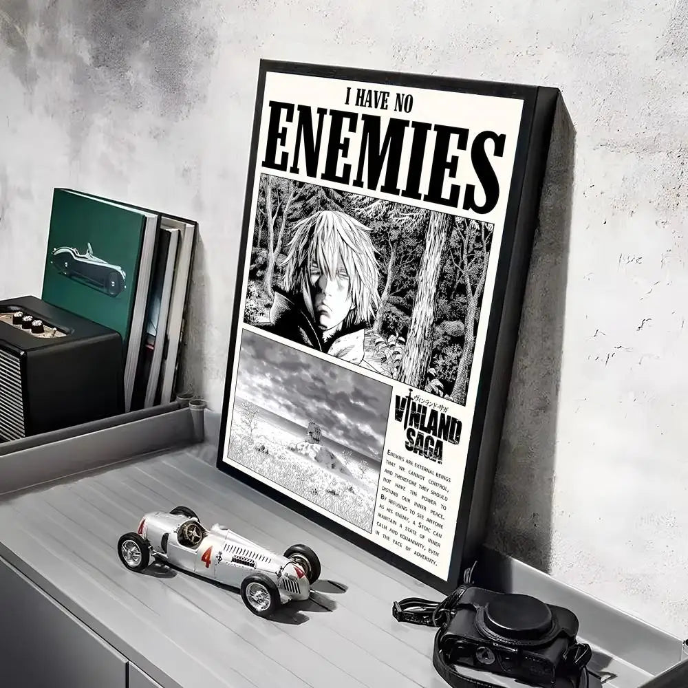 A framed poster of the Vinland Saga anime featuring a character in a forest setting, displayed on a gray shelf.