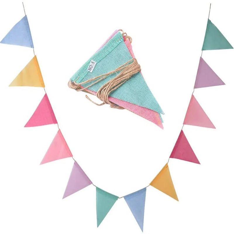 A pennant banner set featuring triangular flags in shades of blue, pink, and green made of jute linen.