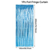 A vertical curtain made of iridescent blue foil fringe used as a party backdrop